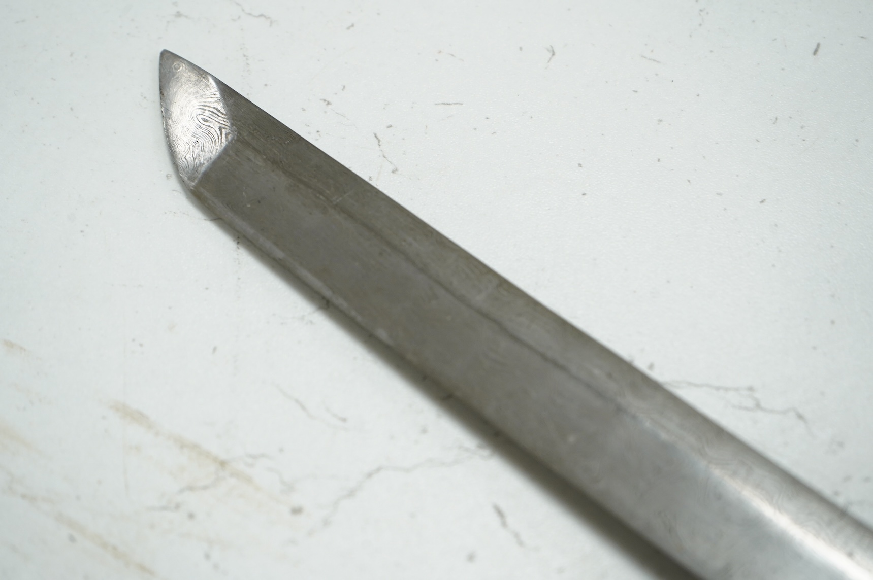 A well-made Chinese copy of a Japanese sword katana, blade etched with wood grain imitation, green painted handle, scabbard with engraved brass mounts